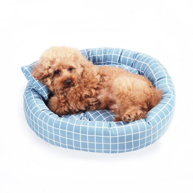 枕ドーナツCuddler猫犬が付いている卸し売り円形の柔らかく暖かいペット ベッドはスリップの底が付いているペット ベッドの贅沢を非寝かせる